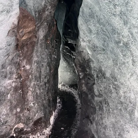 A narrow passage inside a glacier ice cave